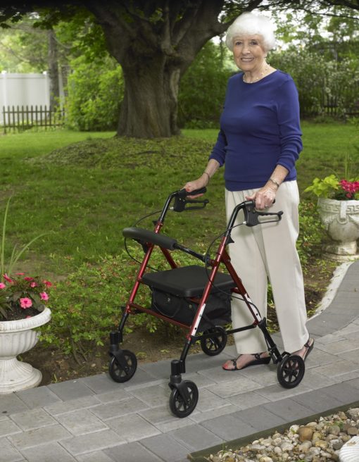 Lady in garden walking with rollator