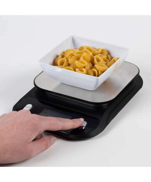 Weighing pasta on talking digital weighing scales