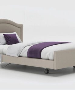 Signature upholstered profiling care bed with arched headboard.