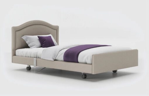 Signature upholstered profiling care bed with arched headboard.