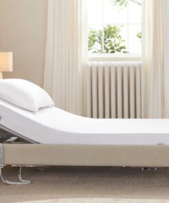 Signature low footboard upholstered profiling care bed in a bedroom.