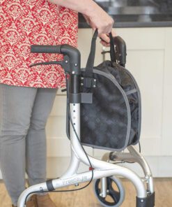 Lady removing shopping bag from rollator