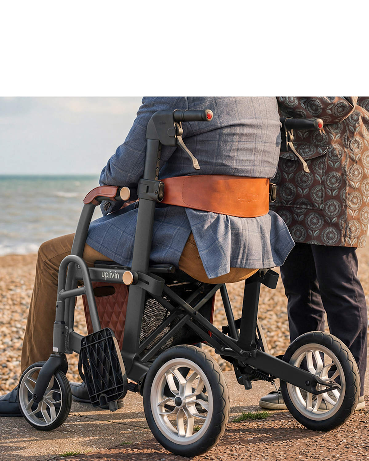 Man sitting on combi rollator wheelchair Man sitting on combi rollator wheelchair