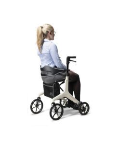 lady sitting on aerowalk carbon fibre rollator in butter cream